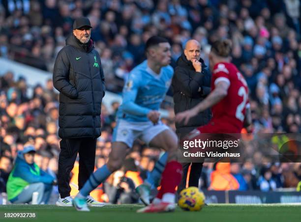 Liverpool manager Jurgen Klopp and Manchester City manager Pep Guardiola during the Premier League match between Manchester City and Liverpool FC at...