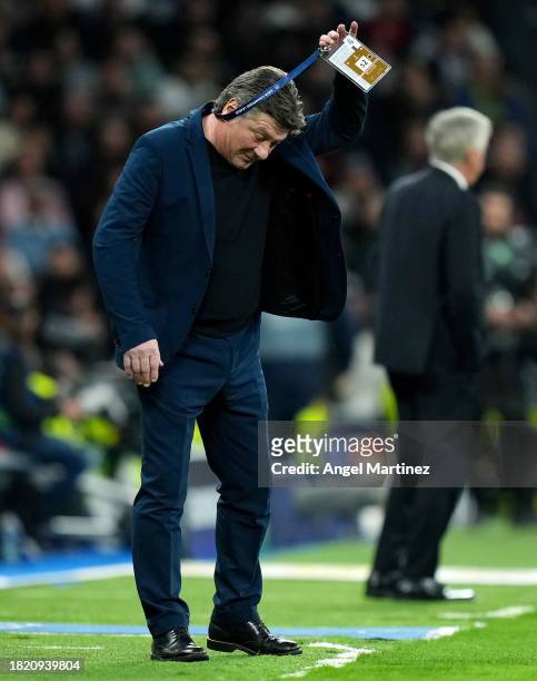 Walter Mazzarri, Head Coach of SSC Napoli, reacts during the UEFA Champions League match between Real Madrid and SSC Napoli at Estadio Santiago...