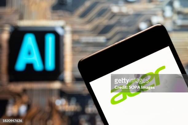 In this photo illustration, the Taiwanese multinational hardware and electronics corporation Acer logo seen displayed on a smartphone with an...