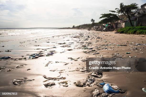 beach full of garbage. garbage, plastic bags and bottles. climate change and pollution. mui ne, vietnam. - contamination stock pictures, royalty-free photos & images