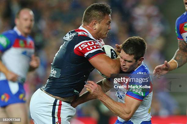 Jared Waerea-Hargreaves of the Roosters crashes into Danny Buderus of the Knights during the NRL Preliminary Final match between the Sydney Roosters...