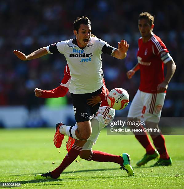 Djamal Abdoun of Nottingham Forest battles with Adam Smith of Derby Couunty during the Sky Bet Championship match between Nottingham Forest and Derby...