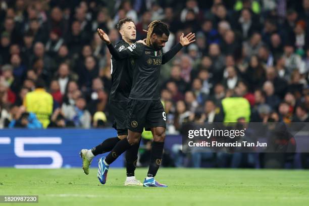 Andre-Frank Zambo Anguissa of SSC Napoli celebrates with teammate Amir Rrahmani after scoring the team's second goal during the UEFA Champions League...