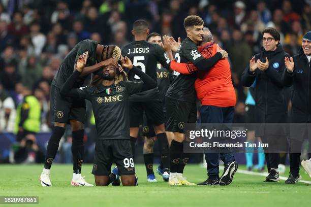 Andre-Frank Zambo Anguissa of SSC Napoli celebrates with teammate Victor Osimhen after scoring the team's second goal during the UEFA Champions...