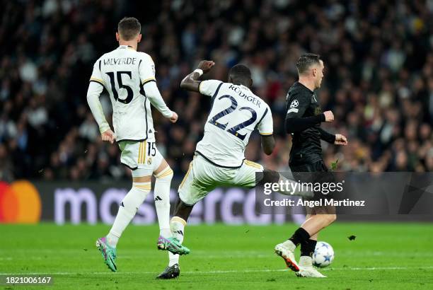 Piotr Zielinski of SSC Napoli is challenged by Antonio Ruediger of Real Madrid during the UEFA Champions League match between Real Madrid and SSC...