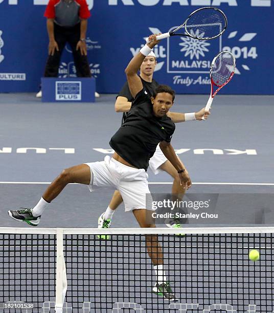 Eric Butorac of the U.S. And Raven Klaasen of South Africa in action during the doubles Semi Finals during Day Six of the 2013 Malaysian Open at...