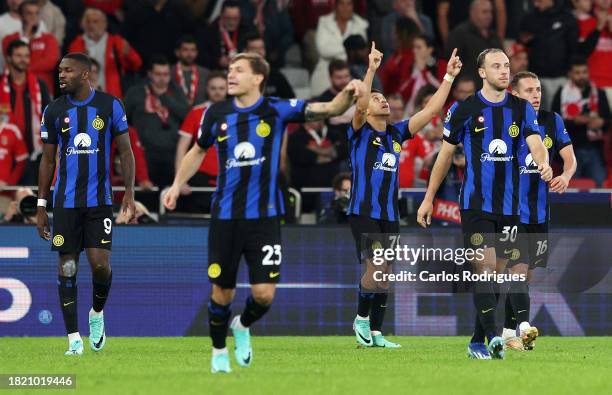 Alexis Sanchez of FC Internazionale celebrates after scoring the team's third goal from the penalty spot during the UEFA Champions League match...