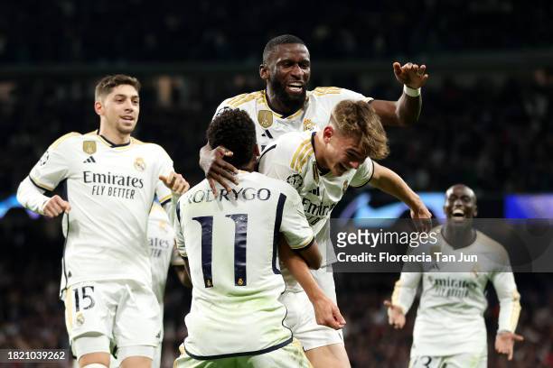 Nico Paz of Real Madrid celebrates with teammates after scoring the team's third goal during the UEFA Champions League match between Real Madrid and...