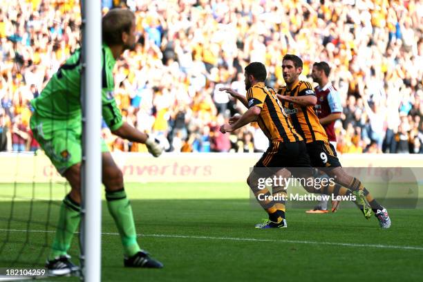 Robbie Brady of Hull City is congratulated by teammate Danny Graham after scoring the opening goal from the penalty spot during the Barclays Premier...