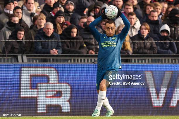 Sergino Dest of PSV throws in the ball during the Dutch Eredivisie match between Feyenoord and PSV at Stadion Feijenoord on December 3, 2023 in...