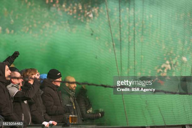 Fans and Supporters of Feyenoord in the smoke during the Dutch Eredivisie match between Feyenoord and PSV at Stadion Feijenoord on December 3, 2023...