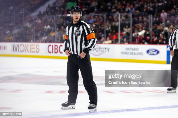 Referee Kevin Pollock before a face-off during second period National Hockey League action between the Seattle Kraken and Ottawa Senators on December...