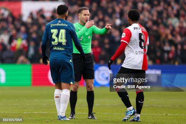 Referee Danny Makkelie in discussion with Ismael Saibari of PSV, and Quinten Timber of Feyenoord during the Dutch Eredivisie match between Feyenoord...