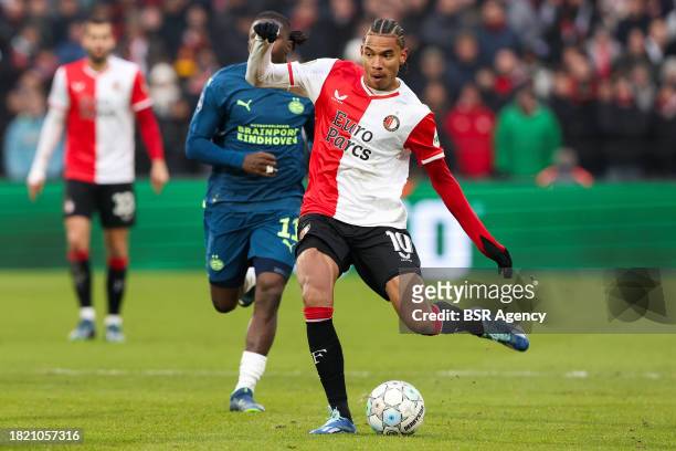 Calvin Stengs of Feyenoord shoots the ball during the Dutch Eredivisie match between Feyenoord and PSV at Stadion Feijenoord on December 3, 2023 in...