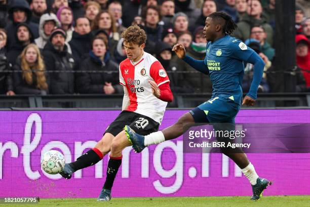 Mats Wieffer of Feyenoord is challenged by Johan Bakayoko of PSV during the Dutch Eredivisie match between Feyenoord and PSV at Stadion Feijenoord on...