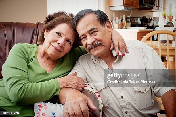 Older, retired couple on couch