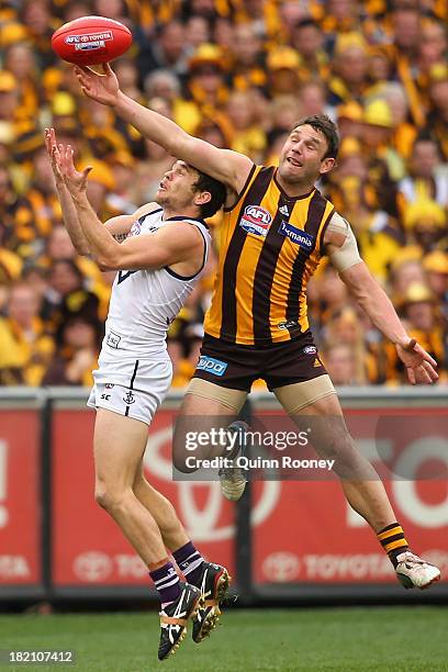 Brent Guerra of the Hawks spoils a mark by Hayden Ballantyne of the Dockers during the 2013 AFL Grand Final match between the Hawthorn Hawks and the...