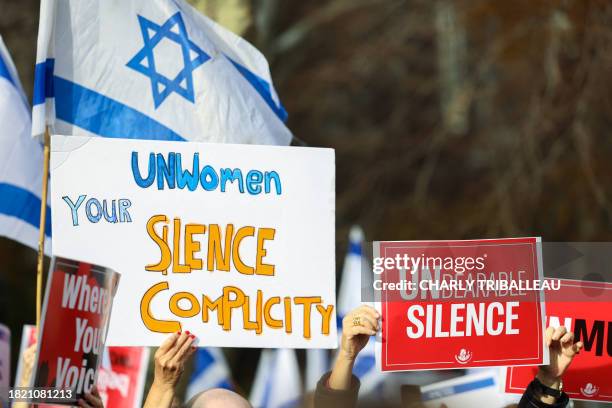 Demonstrators gather during a "#metoo unless you are a Jew" protest outside of United Nations headquarters in New York City on December 4, 2023....