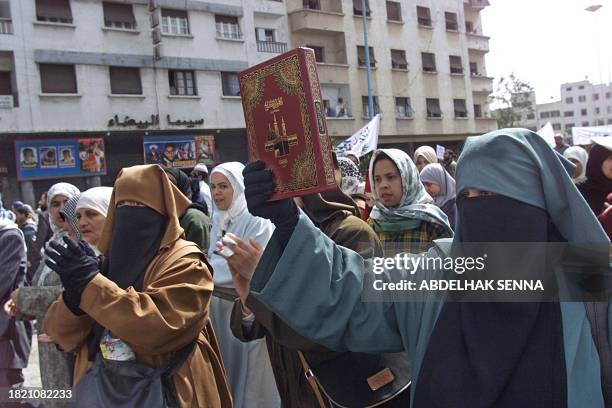 Some 200,000 supporters of Islamic hardliners demonstrate during a rally called by the opposition PJD party and the banned policital party Al Adel...