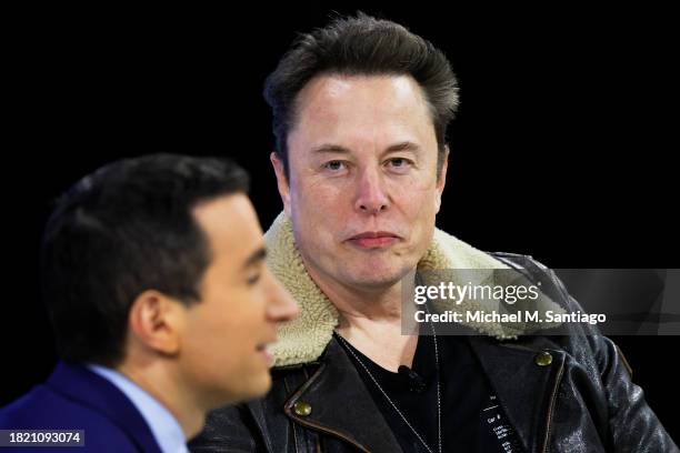 Columnist Andrew Ross Sorkin and C.E.O. Of Tesla, Chief Engineer of SpaceX and C.T.O. Of X Elon Musk speak during the New York Times annual DealBook...