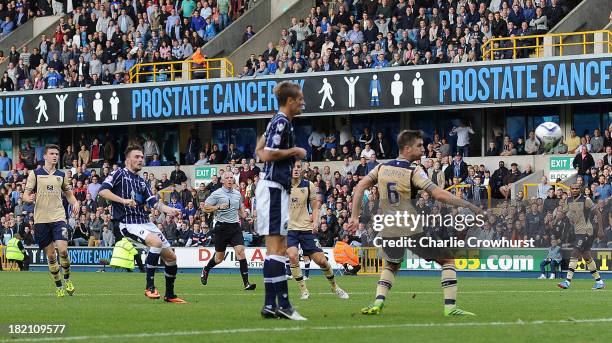 Scott Malone of Millwall scores the teams second goal during the Sky Bet Championship match between Millwall and Leeds United at The Den on September...