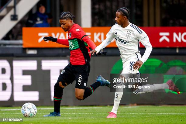 Sontje Hansen of NEC battles for possession with ArJany Martha of AFC Ajax during the Dutch Eredivisie match between NEC Nijmegen and AFC Ajax at...