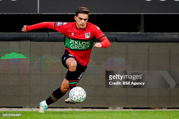 Bart van Rooij of NEC runs with the ball during the Dutch Eredivisie match between NEC Nijmegen and AFC Ajax at Goffertstadion on December 3, 2023 in...