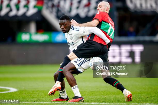 Brian Brobbey of AFC Ajax battles for possession with Bram Nuytinck of NEC during the Dutch Eredivisie match between NEC Nijmegen and AFC Ajax at...