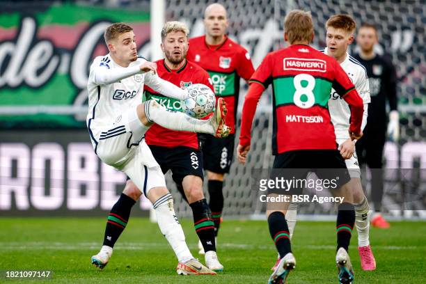 Kenneth Taylor of AFC Ajax battles for possession with Lasse Schone of NEC during the Dutch Eredivisie match between NEC Nijmegen and AFC Ajax at...