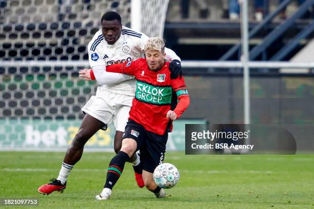 Brian Brobbey of AFC Ajax battles for possession with Lasse Schone of NEC during the Dutch Eredivisie match between NEC Nijmegen and AFC Ajax at...