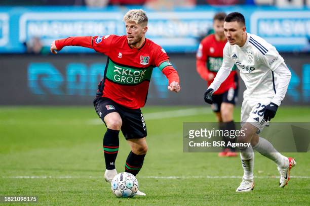 Lasse Schone of NEC runs with the ball during the Dutch Eredivisie match between NEC Nijmegen and AFC Ajax at Goffertstadion on December 3, 2023 in...