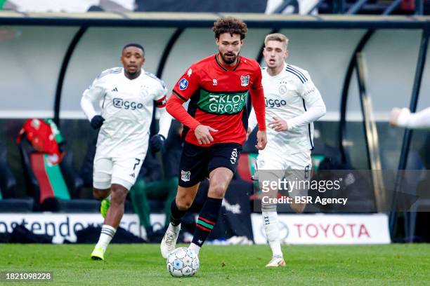 Philippe Sandler of NEC runs with the ball during the Dutch Eredivisie match between NEC Nijmegen and AFC Ajax at Goffertstadion on December 3, 2023...