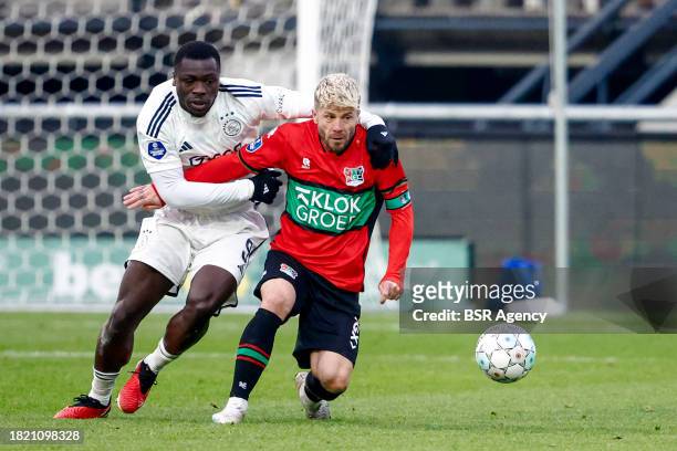 Brian Brobbey of AFC Ajax battles for possession with Lasse Schone of NEC during the Dutch Eredivisie match between NEC Nijmegen and AFC Ajax at...
