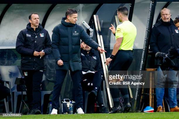 Head Coach Rogier Meijer of NEC in discussion with Referee Marc Nagtegaal during the Dutch Eredivisie match between NEC Nijmegen and AFC Ajax at...