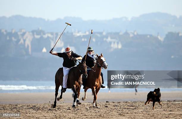 Michael and Georgette Goodwill practice polo on the beach adjacent to the Old Course in St Andrews, Fife, Scotland, on September 28 where the Alfred...