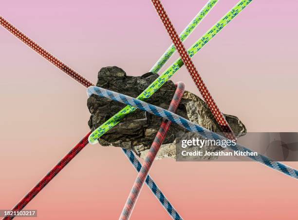 rock in mid air with ropes - extreme sports equipment stock pictures, royalty-free photos & images