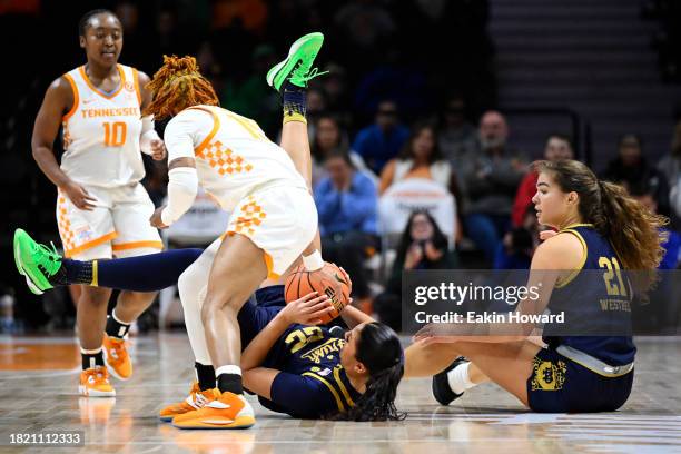 Kylee Watson of the Notre Dame Fighting Irish and Jasmine Powell of the Tennessee Lady Vols wrestle for a loose ball in the second quarter at...