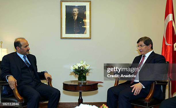 Turkish Foreign Minister Ahmet Davutoglu meets with the head of the Syrian National Coalition Ahmad al-Jarba on the sidelines of the 68th session of...