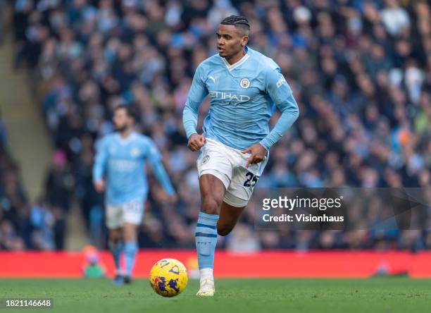 Manuel Akanji of Manchester City in action during the Premier League match between Manchester City and Liverpool FC at Etihad Stadium on November 25,...