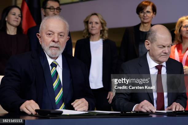 German Chancellor Olaf Scholz and Brazilian President Luiz Inacio Lula da Silva sign a bilateral contract at Chancellory on December 4, 2023 in...