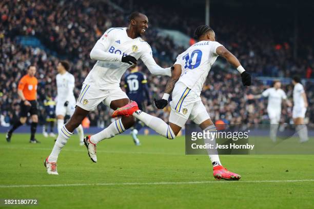 Crysencio Summerville of Leeds United celebrates with teammate Glen Kamara after scoring the team's second goal during the Sky Bet Championship match...