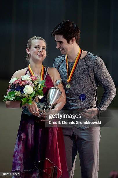 Madison Hubbel and Zachary Donohue of the United States pose with the trophy after the Ice Dance Free Dance competition during day three of the ISU...