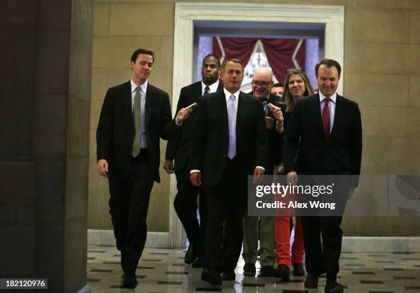 Speaker of the House Rep. John Boehner is followed by members of the media as he is on his way returning to his office after a procedural vote on the...