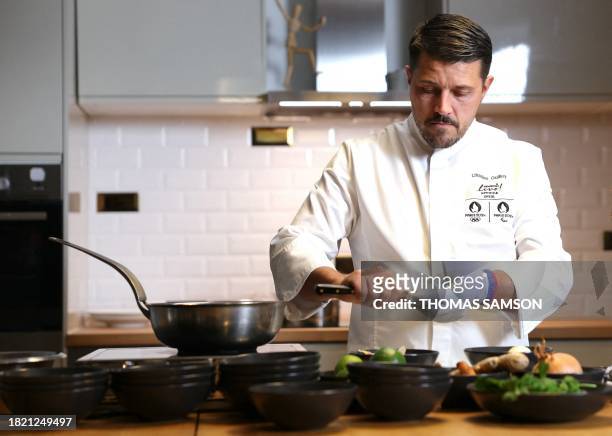 Executive chef for the Olympic Village of the Paris 2024 Olympic and Paralympic Games, Charles Guilloy from Sodexo Live!, cooks during a photo...