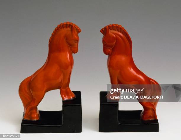 Pair of bookends representing horses, black and red ceramic, Perugia manufacture, Italy, 20th century.