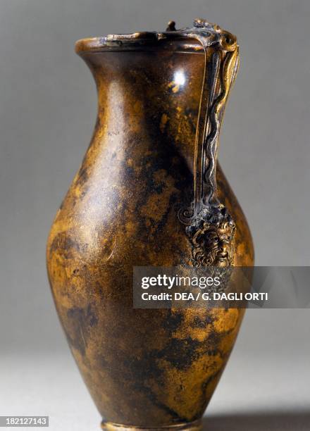 Bronze jug with snake shaped handle ending with the head of Bacchus. Roman Civilisation. Nimega, Rijksmuseum Gm Kam