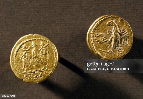 Gold coins depicting an eagle and Koson from Sarmizegetusa Regia, Romania. Dacian-Roman coins, 2nd-1st century BC.