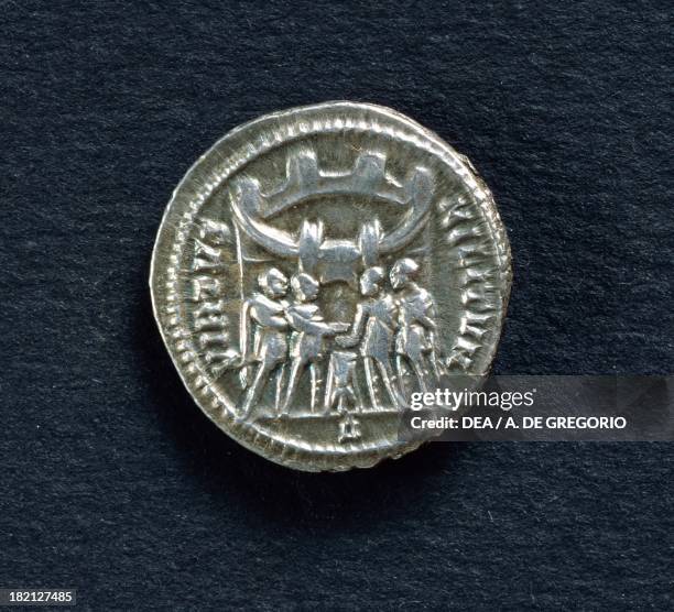 Diocletian argenteus depicting the four emperors making a sacrifice in front of the city walls, verso. Roman coins, 3rd-4th century AD.