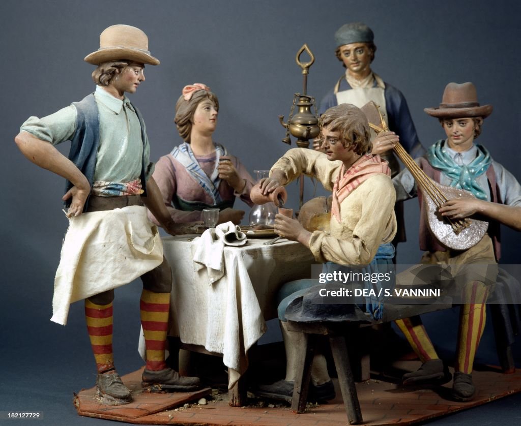 Characters at a table in an osteria...