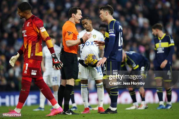 Referee Darren England speaks to Jonny Howson of Middlesbrough after a penalty is awarded to Leeds United during the Sky Bet Championship match...
